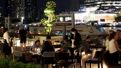 people socializing at an outdoor evening venue