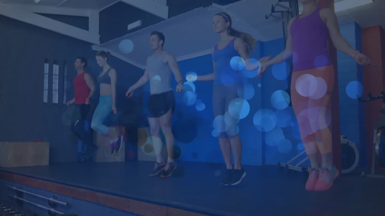 Group stepping onto platform starting animated timer guiding synchronized jump rope fitness routine