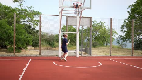 person playing basketball outdoors