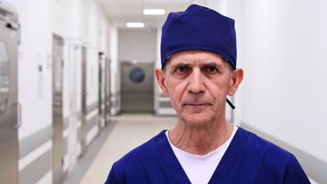 Portrait-of-mature-doctor-on-the-corridor