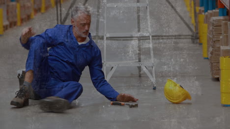 animation of shapes moving over falling caucasian male worker in warehouse