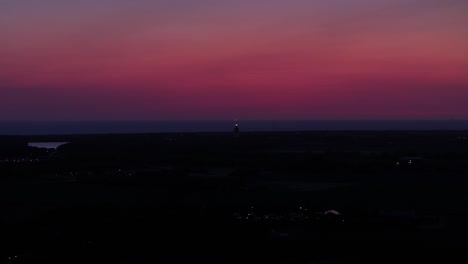 red sunset sky at twilight over the coastline of zeeland in the netherlands