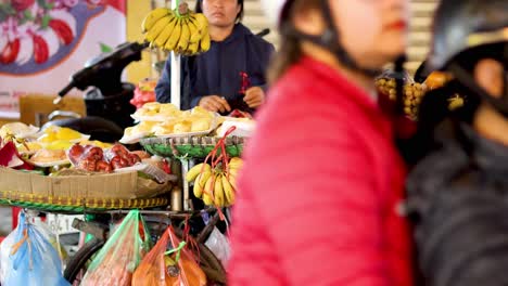 vendor selling various fruits on a bicycle cart