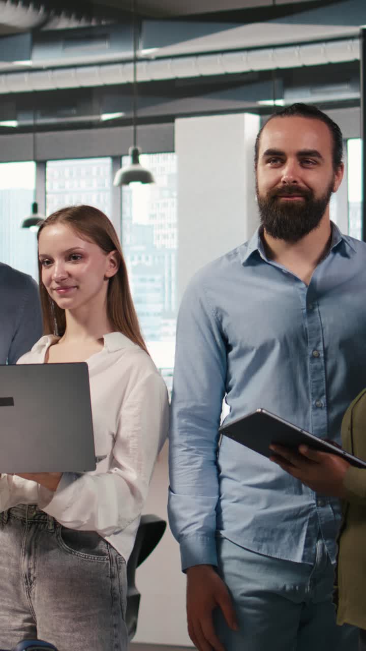 Vertical video Team of programmers in office automating repetitive tasks using AI scripts