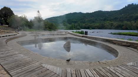 establishing shot of muiño da veiga thermal baths in ourense, galicia, spain