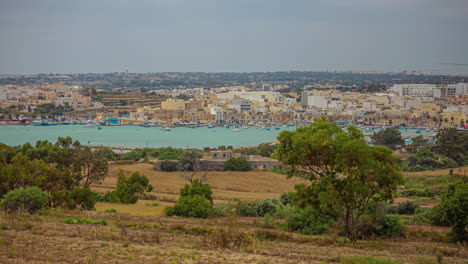 Timelapse-view-overlooking-Marsaxlokk,-Malta-city