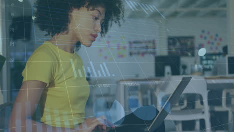 animation of data processing over biracial businesswoman using laptop