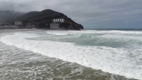 Aerial-drone-view-of-the-beach-of-Bakio-in-the-Basque-Country-in-a-foggy-day