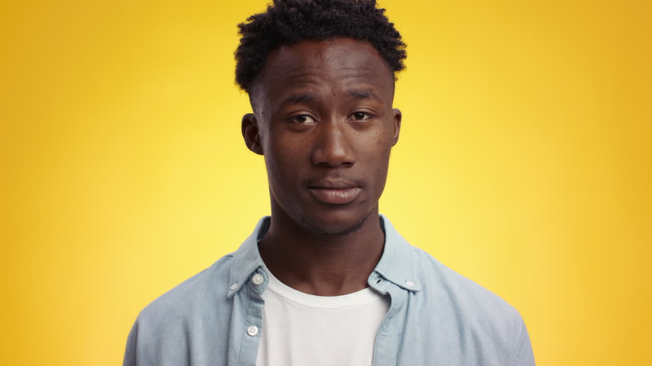 Man with a profile view against a yellow background