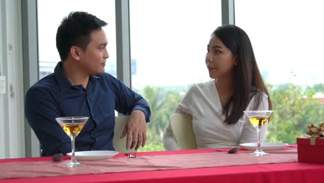 happy romantic couple eating lunch at restaurant