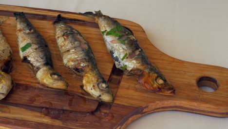 Pouring-sardines-with-lemon-juice-before-eating