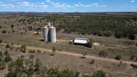 right to left circular aerial views over grain silos just outside wandoan, queensland.