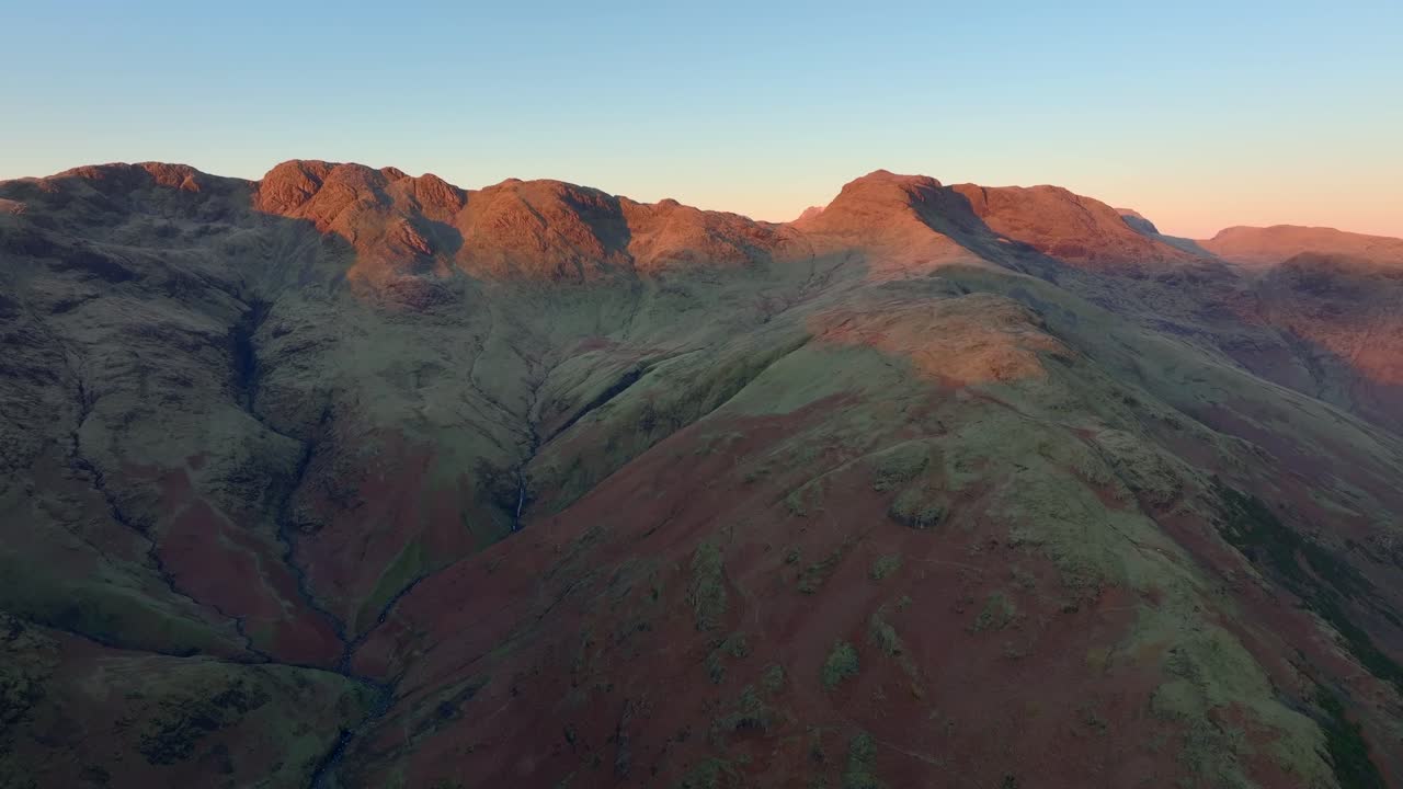 Craggy mountains catching winter dawn light. Crinkle Crags, Langdales, English Lake District, Cumbria, UK.