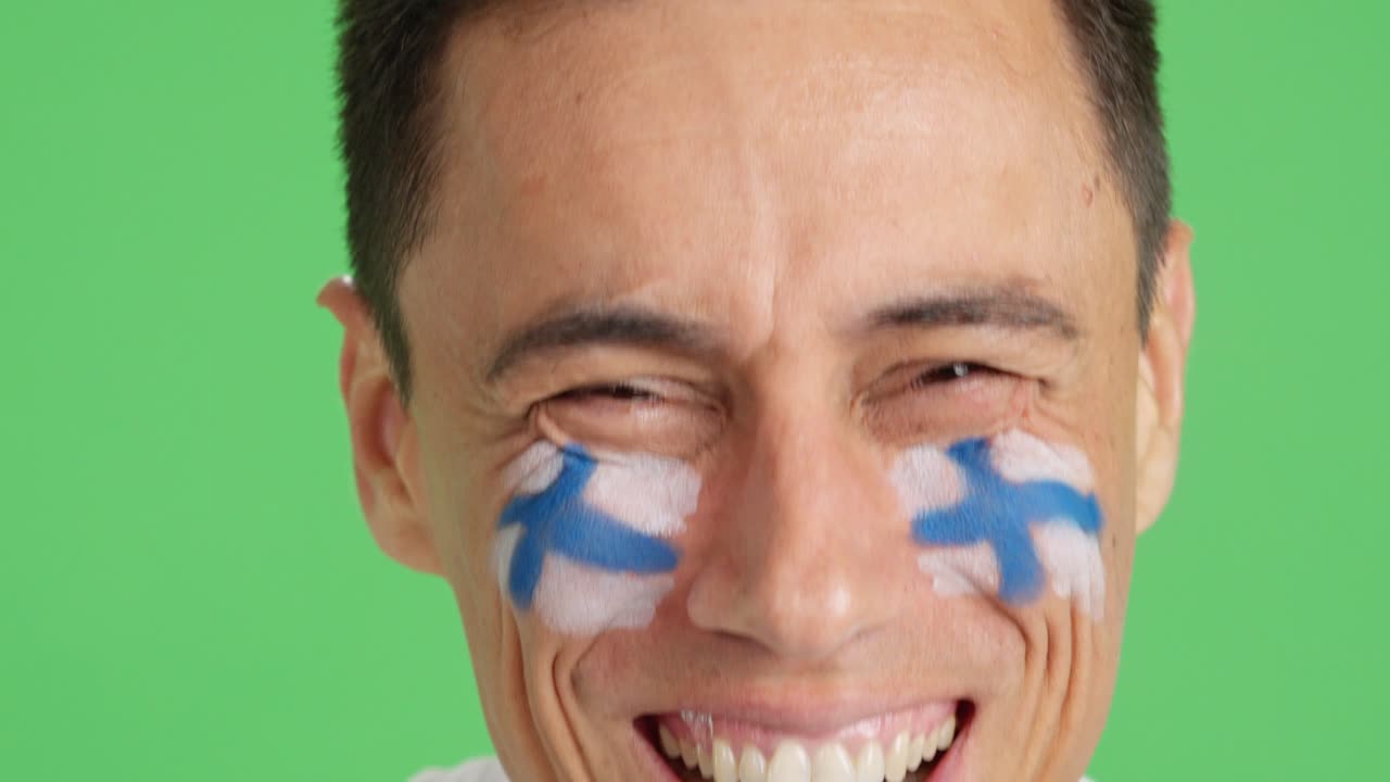 Close up of a man supporting finnish team