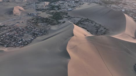 desert sand dunes and city town of peru