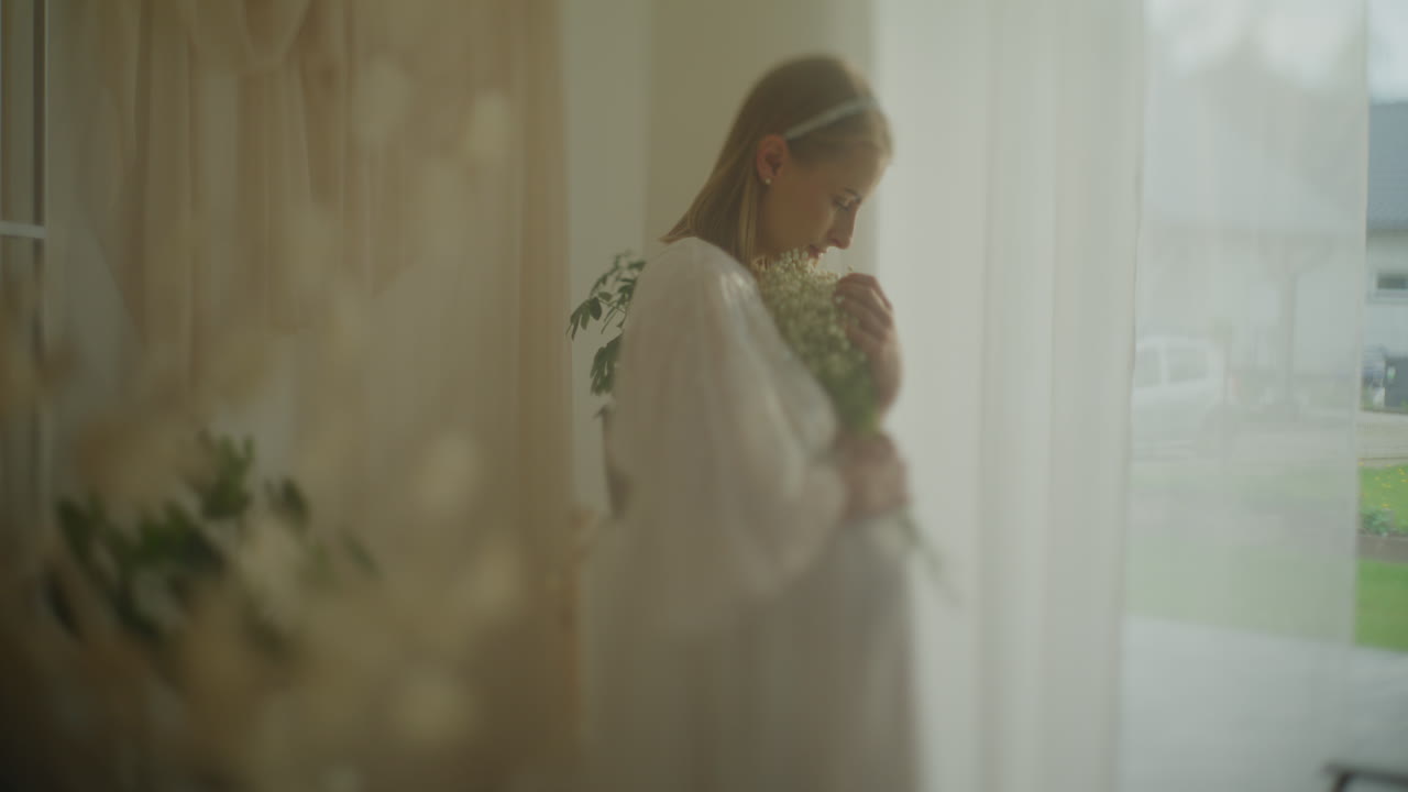 Pregnant Woman Holding Baby's Breath Flowers