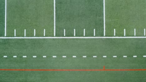 top down aerial of yard markings on american football, soccer field