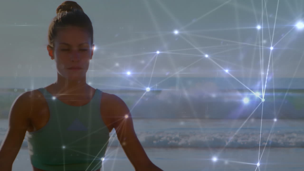 animación de la red de conexiones sobre mujer caucásica meditando en la playa