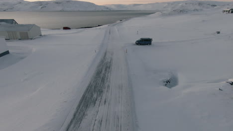 view at countryside road next to shore in winter time