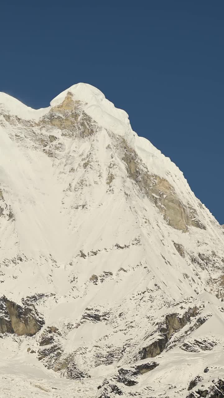 Vertical Snowcapped Mountains in Nepal and Clear Blue Sky, Vertical Video for Social Media Instagram Reels and Tiktok of Snowy Winter Himalayas Mountains Covered in Snow in Nepal