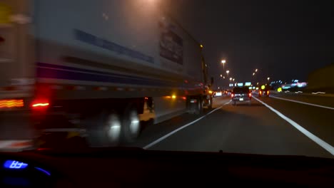 time-lapse of driving pov at night - side streets and highway