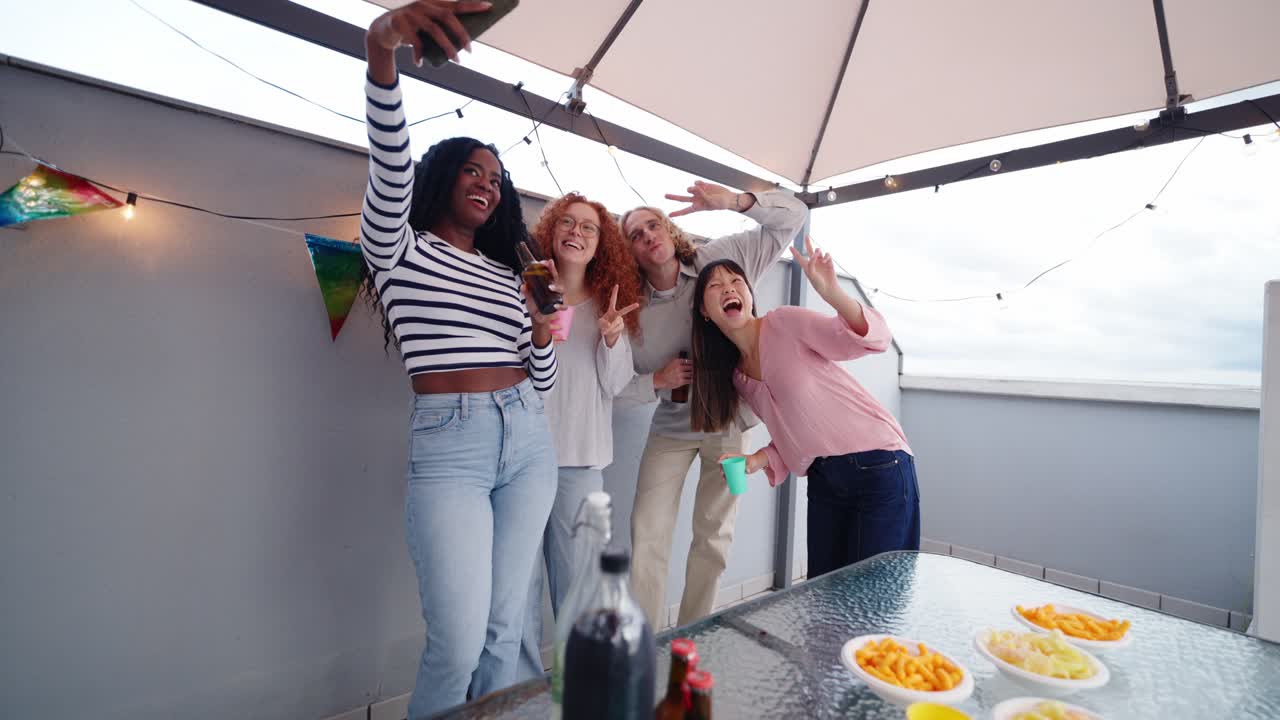 Friends Taking a Selfie at a Rooftop Party