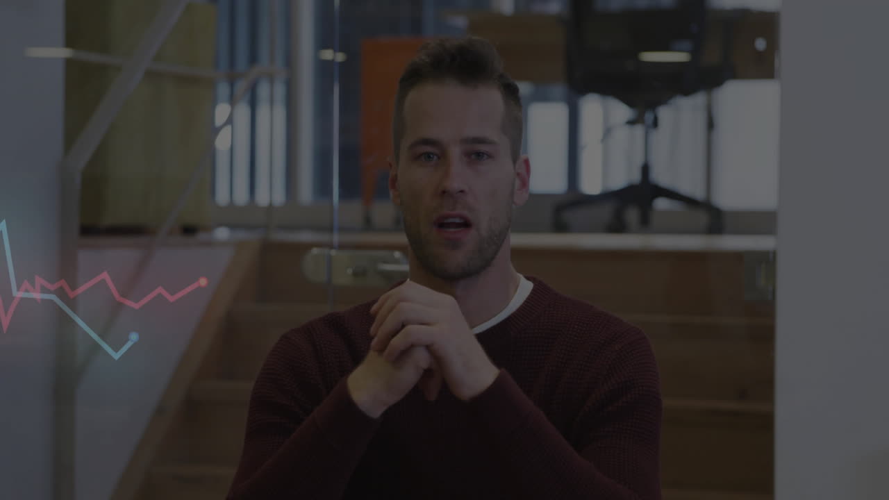 Man in office setting with graph animation overlay on left side