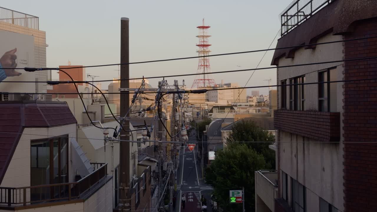 Sunset View Over Gakugei Daigaku Neighborhood A tranquil view from Gakugei Daigaku station, overlooking the peaceful neighborhood as the sun sets