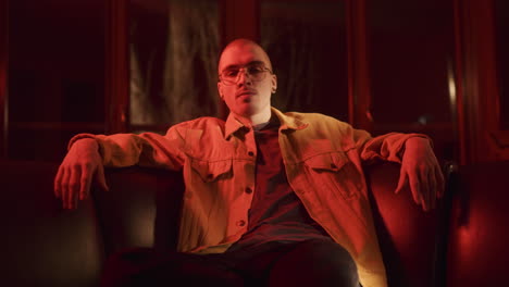 man in a yellow jacket, red light portrait