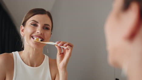 woman brushing her teeth