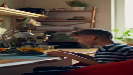 boy playing with robot toy in his bedroom
