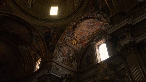 slow pan shot from right to left of a beautiful ceiling of a church in rome, italy in 4k