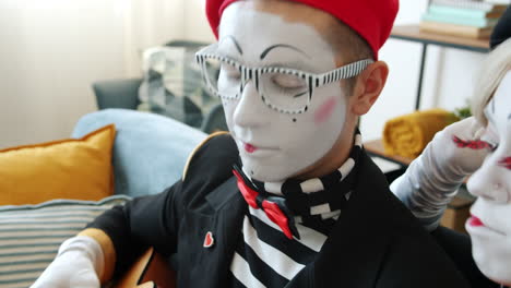 mime couple playing acoustic guitar