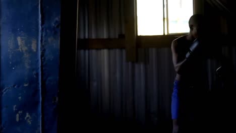 male boxer practicing boxing with punching bag 4k