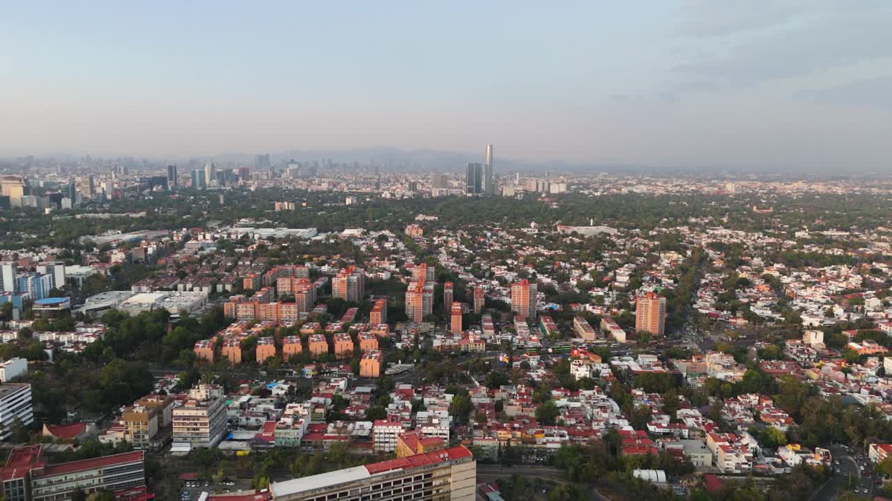 Sunny afternoon aerial pan over southern CDMX