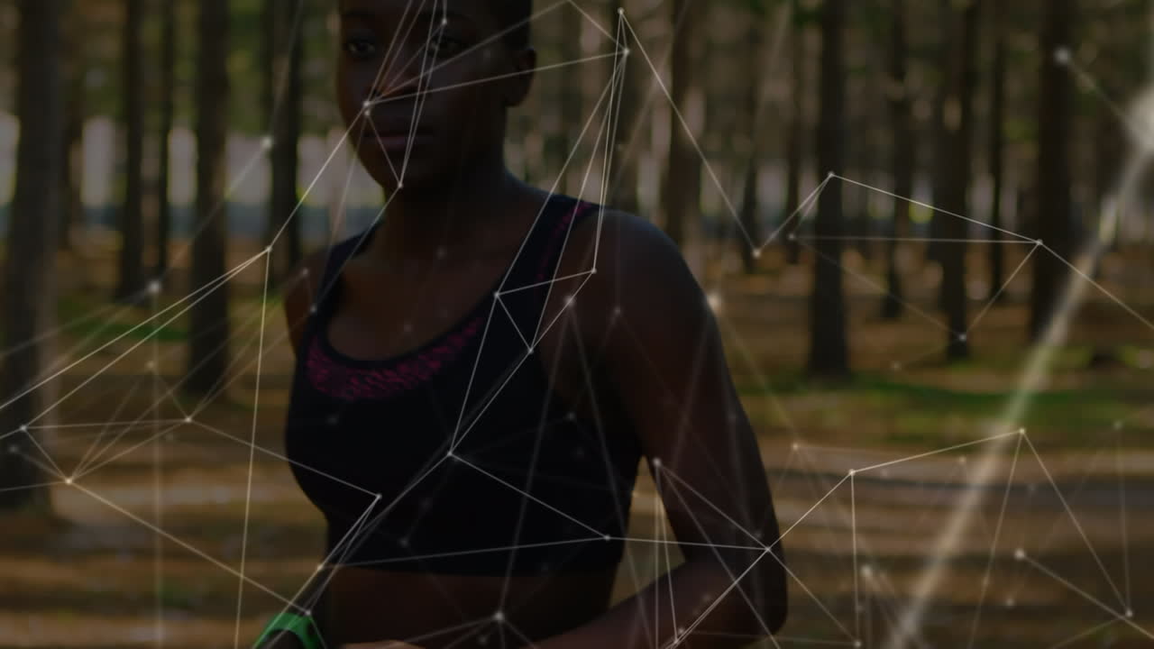 Animation of network of connections over woman exercising in forest
