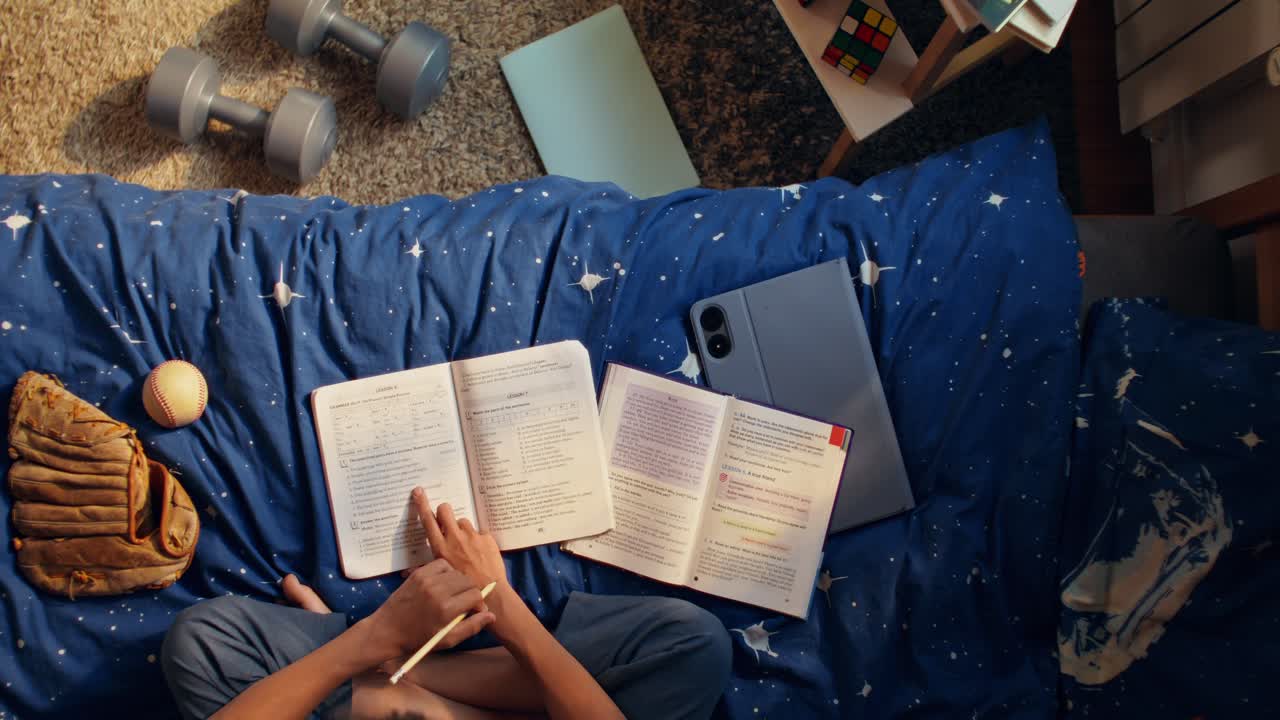 Student studying in bedroom