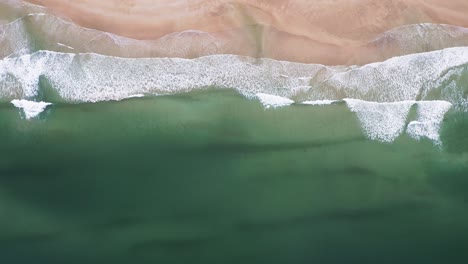 Birds-eye-view-drone-shot-of-the-sea-at-"Traigh-Mhor"-beach-in-Tolsta-on-the-Outer-Hebrides-in-Scotland