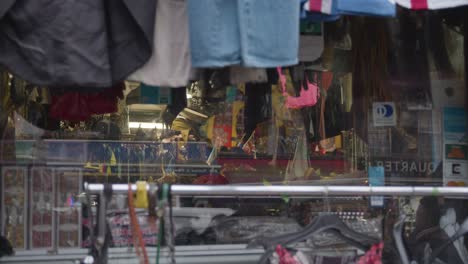 Close-Up-Of-Clothes-Hanging-Outside-Shops-On-Camden-High-Street-In-North-London-UK-3