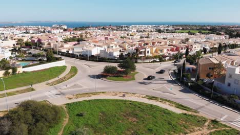 Crane-shot-of-roundabout--with-some-cars-passtroght