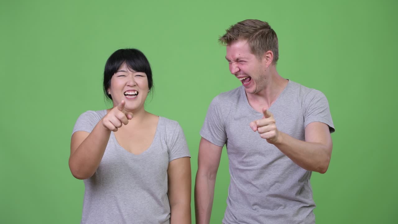 Young multi-ethnic couple laughing together
