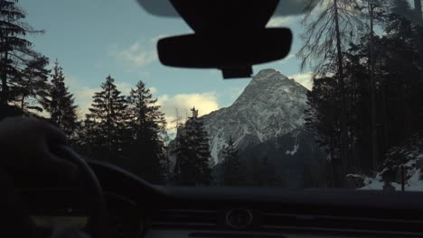 Slow-motion-footage-through-the-car-side-window-while-driving-in-the-Swiss-Alps