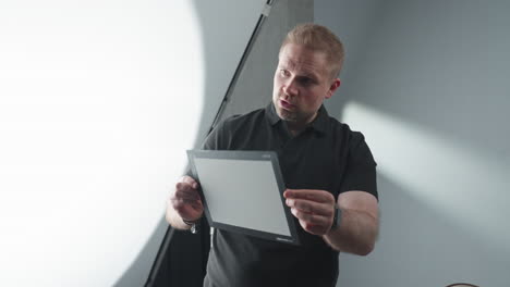 technician testing the color checker in a photo studio