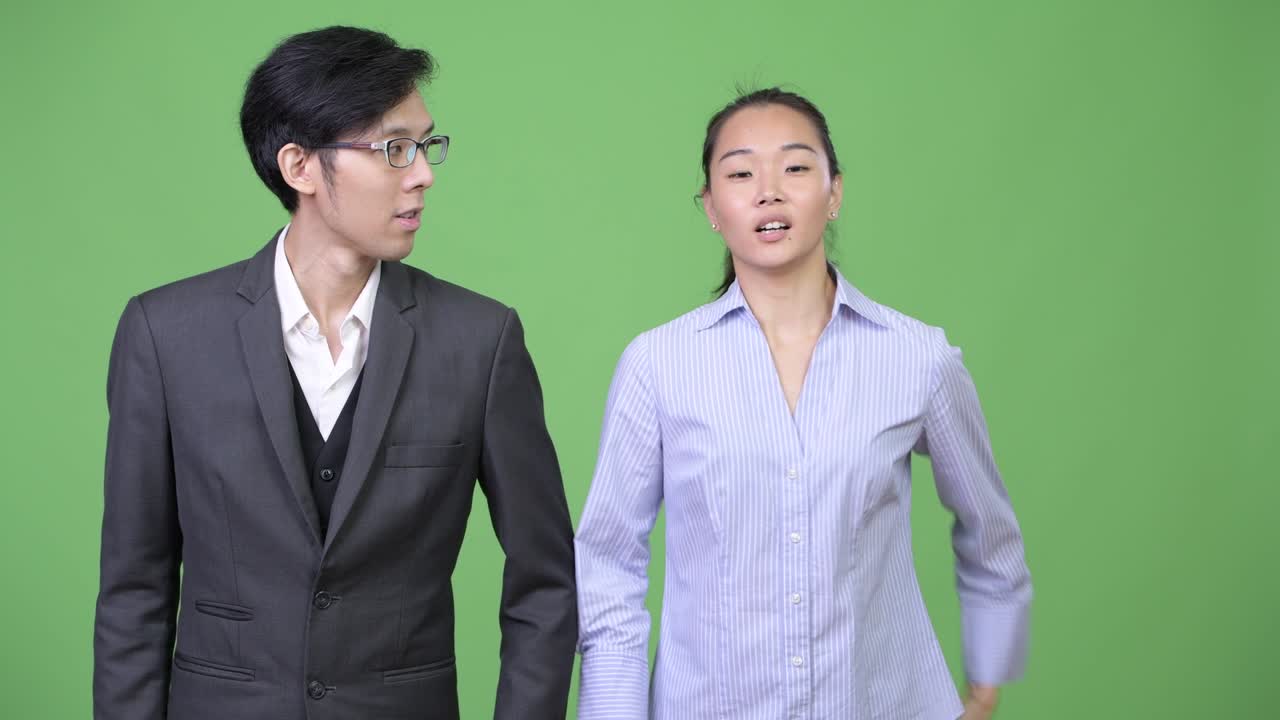 Young Asian business couple together
