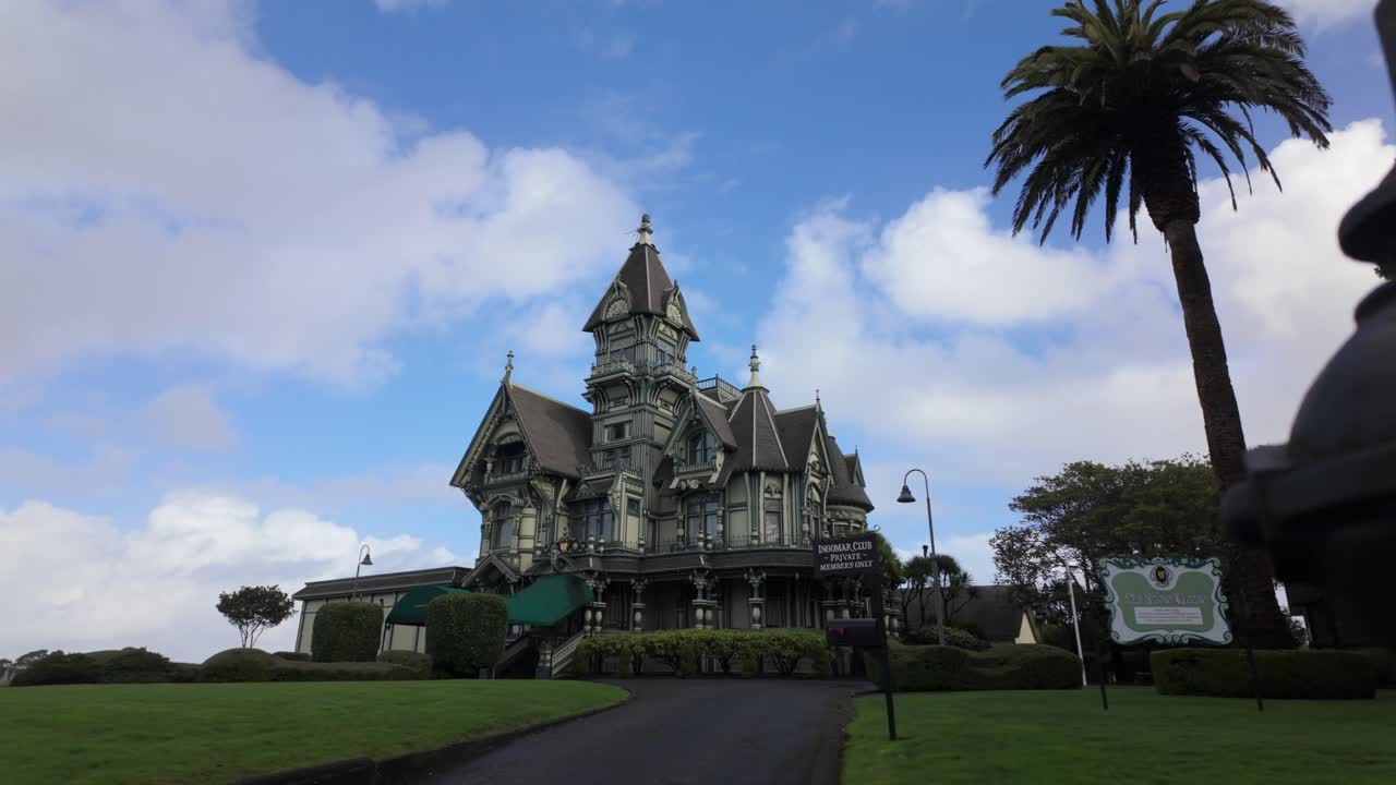 Gimbal wide shot revealing the historic Carson Mansion Victorian home in old town Eureka, California. 4K
