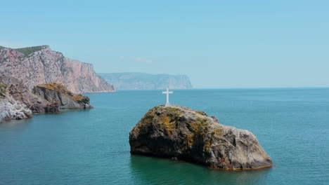 coastal cross on a rocky outcrop