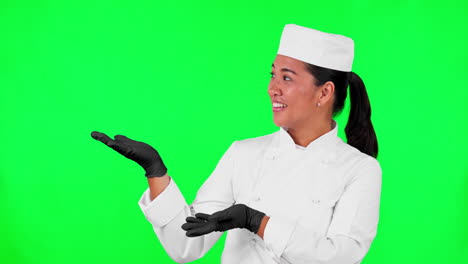 pantalla verde, rostro de mujer y mano de chef apuntando a