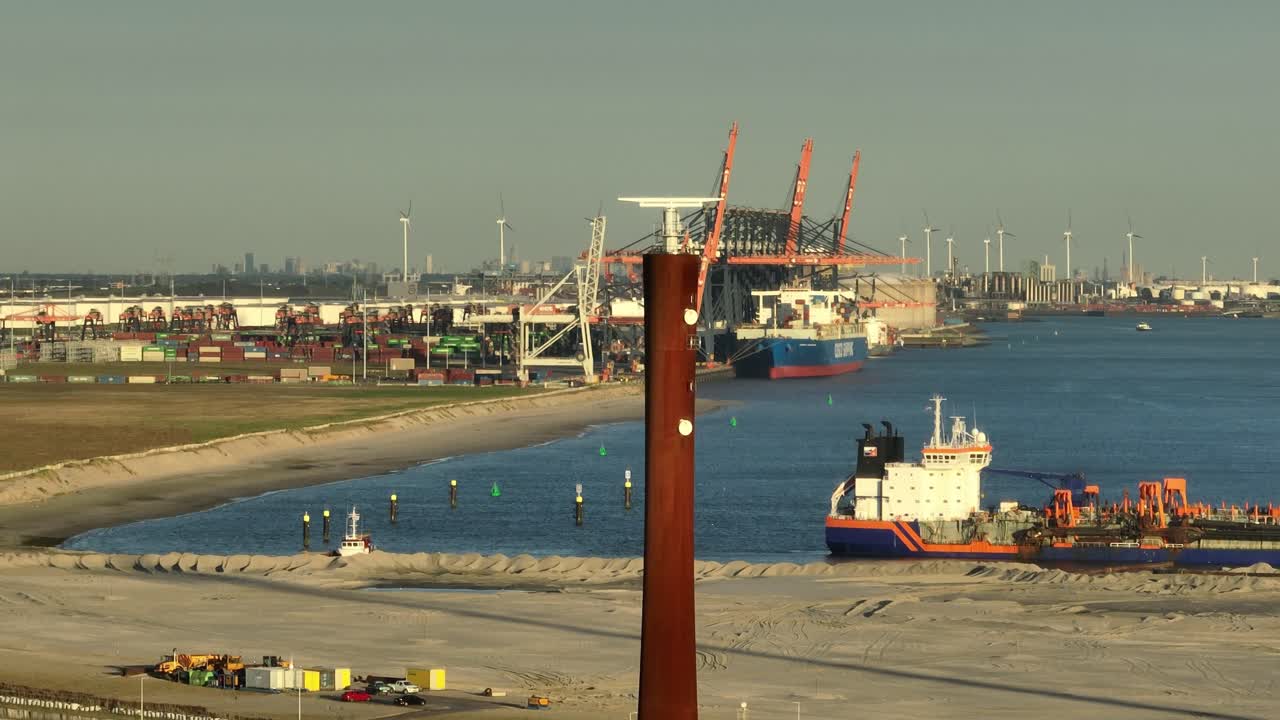 Marine radar tower with rotating antenna at the Rotterdam port used for electronic navigation system, aerial orbital slow motion