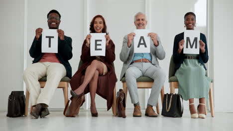 diverse team holding letters spelling "team"
