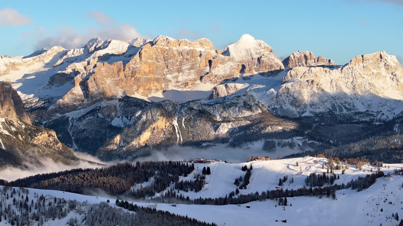 Aerial drone view of snow on the mountains in the Dolomites, Italy